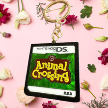 Load image into Gallery viewer, I owe a raccoon a lot of money keychain