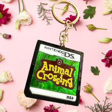 Load image into Gallery viewer, I owe a raccoon a lot of money keychain