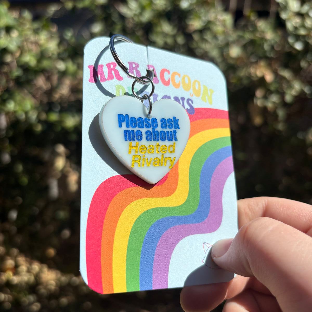 Ask me about heated rivalry Keychain – Mr Raccoon Designs